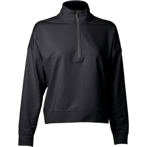 A women's quarter zip top in black with a relaxed fit and a high collar. The garment features a logo.