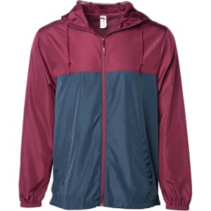 A lightweight windbreaker zip jacket in maroon and navy, featuring a hood and zip closure, with a logo on the front.
