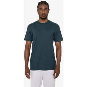 A short sleeve crew tee in a dark teal colour, featuring a subtle logo, displayed on a model.
