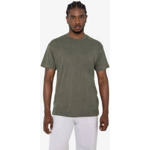 A green short sleeve cotton-poly crew tee displayed on a model. The shirt features a logo on the front.