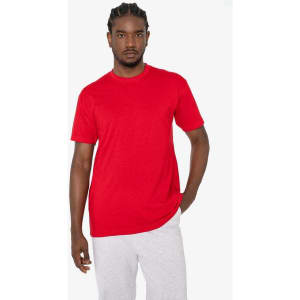 A red short sleeve cotton poly crew t-shirt is displayed on a model, paired with light grey bottoms.