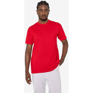 A red short sleeve cotton-poly crew tee on a model, featuring a casual fit and intricate detailing.