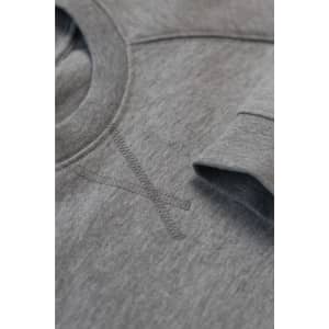 A grey sweatshirt featuring a crew neck and long sleeves, with a subtle logo and stitching detail.