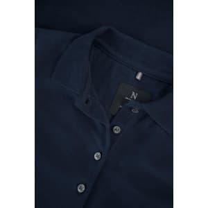A navy blue women's polo shirt with a classic collar and button placket, featuring a logo.