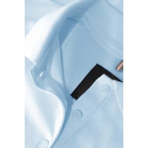 A light blue polo shirt featuring a collar, buttons, and an internal label, with a logo visible.