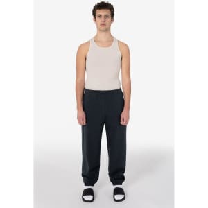 Heavy fleece sweatpants in dark grey, paired with a plain tank top and black sandals.