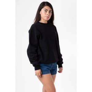 A black heavy fleece pullover jumper displayed on a model wearing denim shorts. The pullover has a logo.