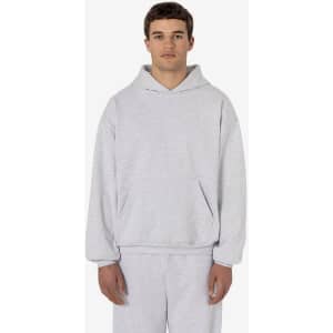 A light grey heavy fleece hood pullover with a relaxed fit and a front pocket. Features a logo on the garment.