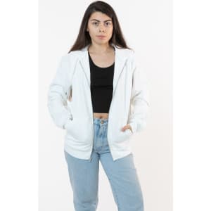 A white heavy fleece zip-up hoodie featuring side pockets, paired with a black top and light blue jeans.