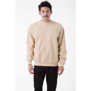 A beige heavy fleece pullover featuring a crew neckline and long sleeves, modelled by a man.