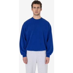 A blue heavy fleece pullover jumper featuring long sleeves and a relaxed fit, worn by a model.