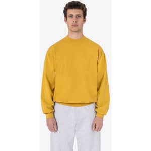 A mustard yellow garment dye heavy fleece pullover, featuring long sleeves and a round neckline.