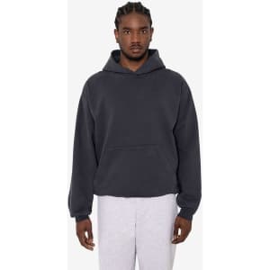 A grey hooded pullover made from heavy fleece, featuring a front pocket and loose fit. It has a logo on it.