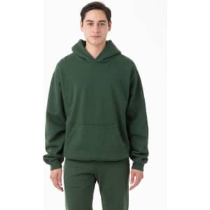 A green garment dye heavy fleece hooded pullover with a front pocket and a relaxed fit.