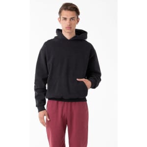 A heavy fleece hooded pullover in black, featuring a front pocket and a relaxed fit, paired with maroon pants.