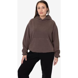 A hooded pullover in a muted brown colour, featuring a front pocket and a relaxed fit. It has a small logo on it.