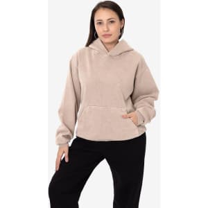 A heavy fleece hooded pullover in beige, featuring a front pocket and a relaxed fit. Includes a logo.
