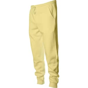 A pair of midweight sweatpants in a pastel yellow colour, featuring an elastic waistband and pockets.