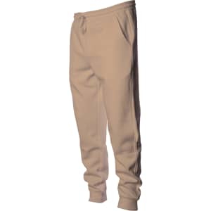 A pair of midweight sweatpants in a light beige colour, featuring pockets and an elastic waistband.