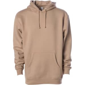 A heavyweight pullover hood in a tan colour, featuring a pouch pocket and a hood with drawstrings. It has a logo.