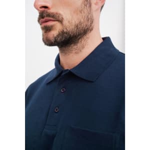 A navy blue polo shirt featuring a pocket and a classic collar, with a three-button placket and branding.