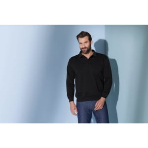 A black polo shirt featured on a model against a light blue background. The shirt has a logo.