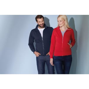 A navy men's jacket and a red women's jacket are displayed on two models against a soft blue background.