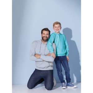A pair of hooded sweatshirts, one light grey on an adult and one teal on a child, against a light blue background.