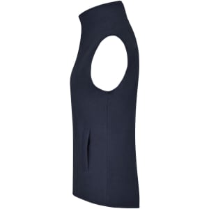 A navy microfleece vest with a high collar and armholes, featuring a side pocket. Includes branding on the label.