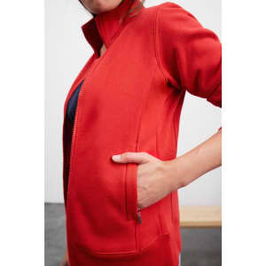 A red ladies jacket with a zippered front and side pockets, showcasing a casual fit. It features a branding logo.