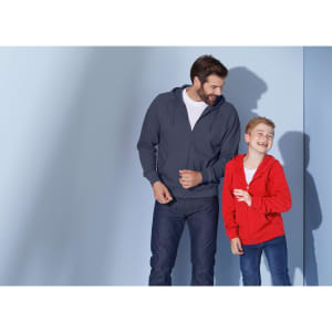 A grey hooded jacket on a man and a red hooded jacket on a boy, both smiling against a light blue background.