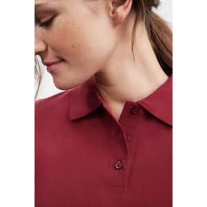 A maroon polo shirt featuring a collared neckline and button details, worn by a model displaying a profile view.