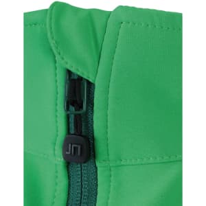 A close-up of a green softshell vest featuring a zip and a small logo.