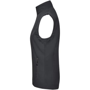 A black ladies softshell vest featuring a zip pocket and a high collar. The vest has no sleeves and a fitted design.