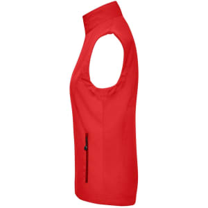 A red ladies softshell vest featuring a sleeveless design and a zippered pocket on the side.