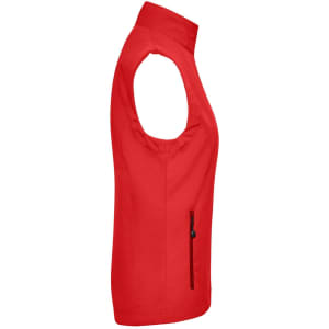 A red ladies softshell vest featuring a zip pocket and symmetrical styling, with a logo on the chest.