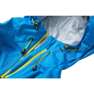 A blue ladies outdoor rain jacket with yellow drawstrings and a textured inner lining. It features a hood and zippered front.