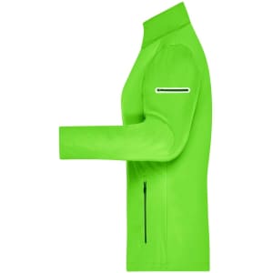 A vibrant green ladies softshell jacket featuring a zippered pocket and a sleek, fitted design.