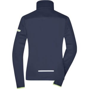 A navy softshell jacket for ladies, featuring a high collar and reflective detailing. It has a logo on the sleeve.