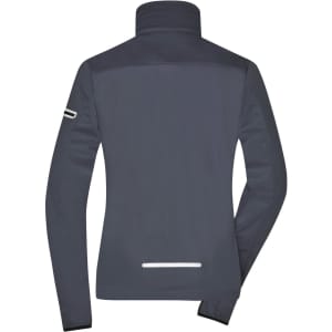 A ladies' softshell jacket in dark grey, featuring a high collar and a reflective strip on the back.