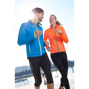 A blue men's softshell jacket and an orange women's softshell jacket, both with zippers, worn by two runners outdoors.