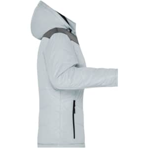 A light grey puffer jacket for women with a hood and zippered pockets. Includes a logo on the sleeve.