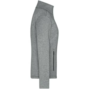 A grey ladies softshell jacket featuring a zippered pocket and a high collar. It has a subtle logo on the front.