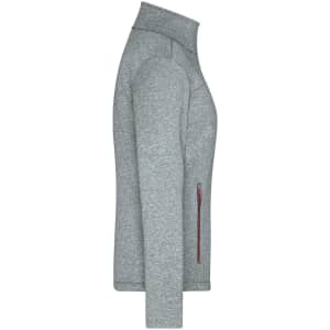 A grey softshell jacket featuring a zip pocket and a high collar, with a branding logo on the side.