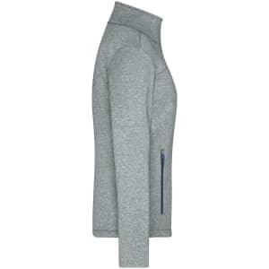 A grey softshell jacket featuring a zip pocket and a high collar. It has branding on the design.