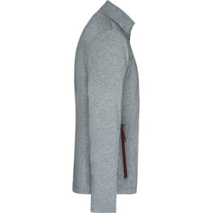 A softshell jacket in grey with a side zip pocket and a collar. It features a logo on the fabric.