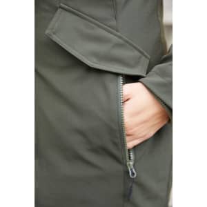 A close-up of a dark green ladies business parka featuring a zippered pocket and a flap detail.
