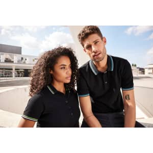 A black polo shirt for ladies and a matching black polo shirt for men, both featuring contrasting trim and a logo.