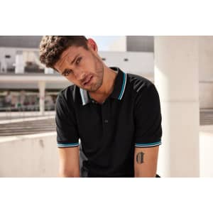A black polo shirt featuring contrasting light blue trim and a logo on the chest.