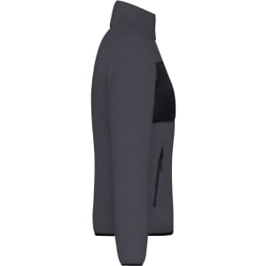 A women's fleece jacket in dark grey with a black panel and zip pocket on the front. Features a high collar.